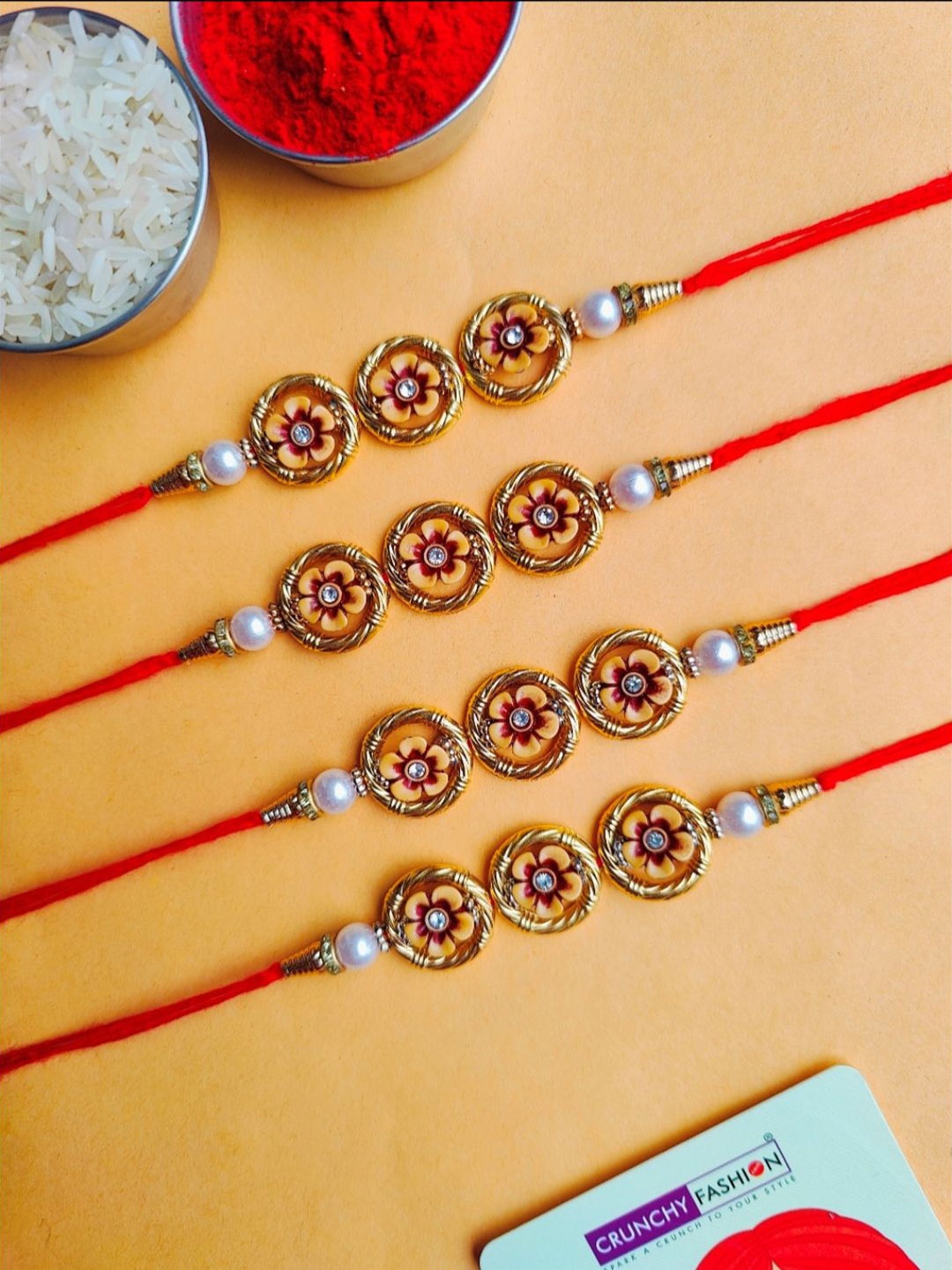

Crunchy Fashion Set Of 4 Beaded Flower Thread Rakhi With Roli Chawal, Gold