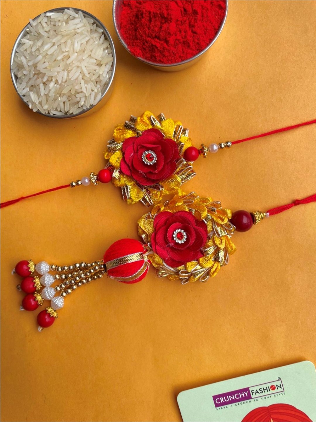 

Crunchy Fashion Floral Bhaiya Bhabhi Thread Rakhi With Roli Chawal, Red