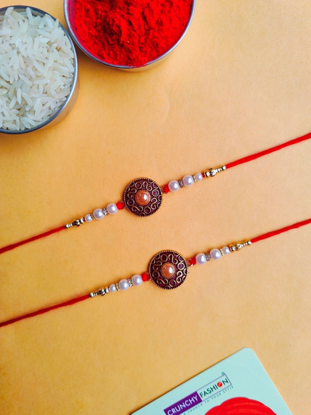 

Crunchy Fashion Set Of 2 Stone Studded & Beaded Rakhi With Roli Chawal, Gold