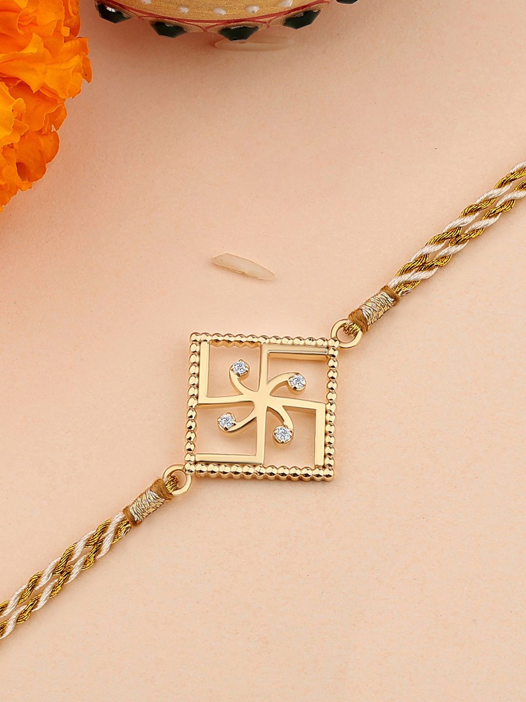 

Ornate Jewels 18K Gold Plated Swastik Charm Thread Rakhi WIth Roli Chawal & Greeting Card
