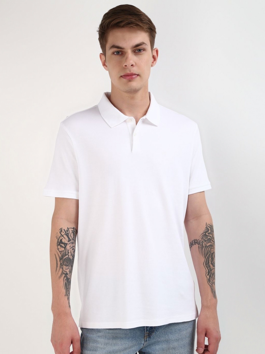 

Calvin Klein Jeans Men Solid Polo Collar Pure Cotton Tshirt, White
