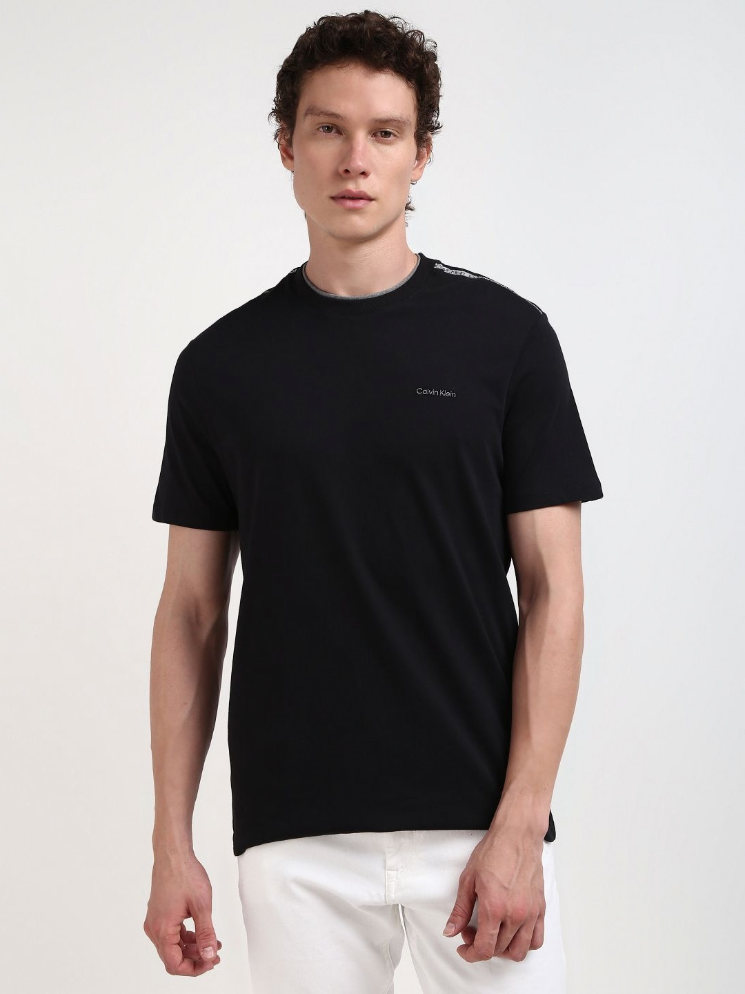 

Calvin Klein Jeans Men Solid Round Neck Pure Cotton Tshirt, Black