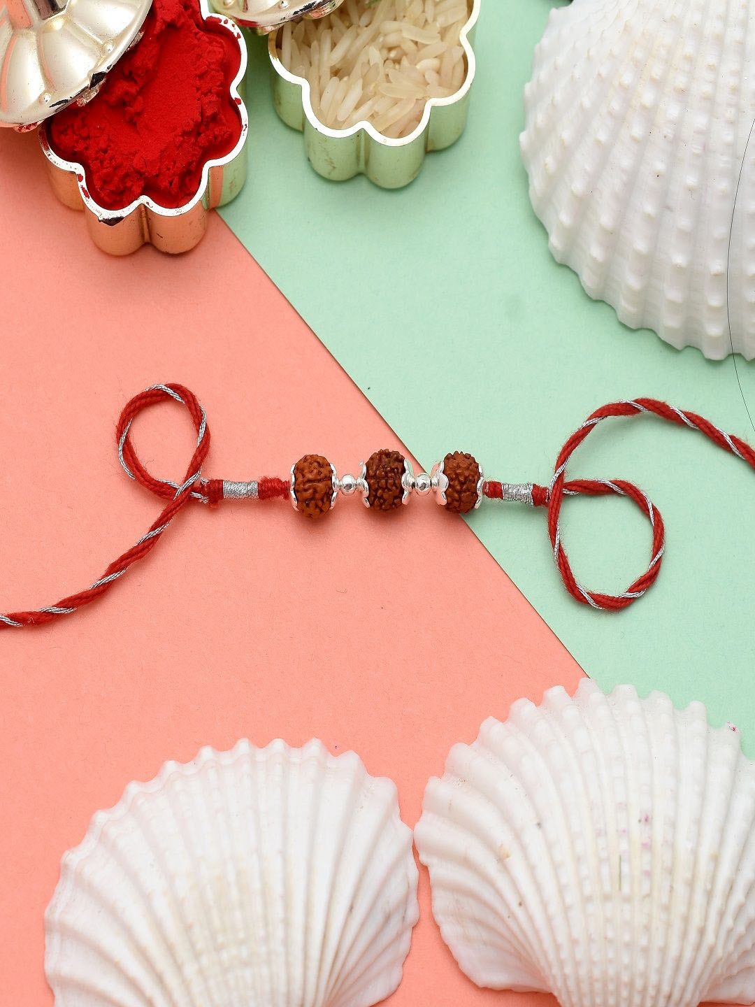 

Abhooshan 92.5 Sterling Silver Rudraksha Rakhi With Roli Chawal