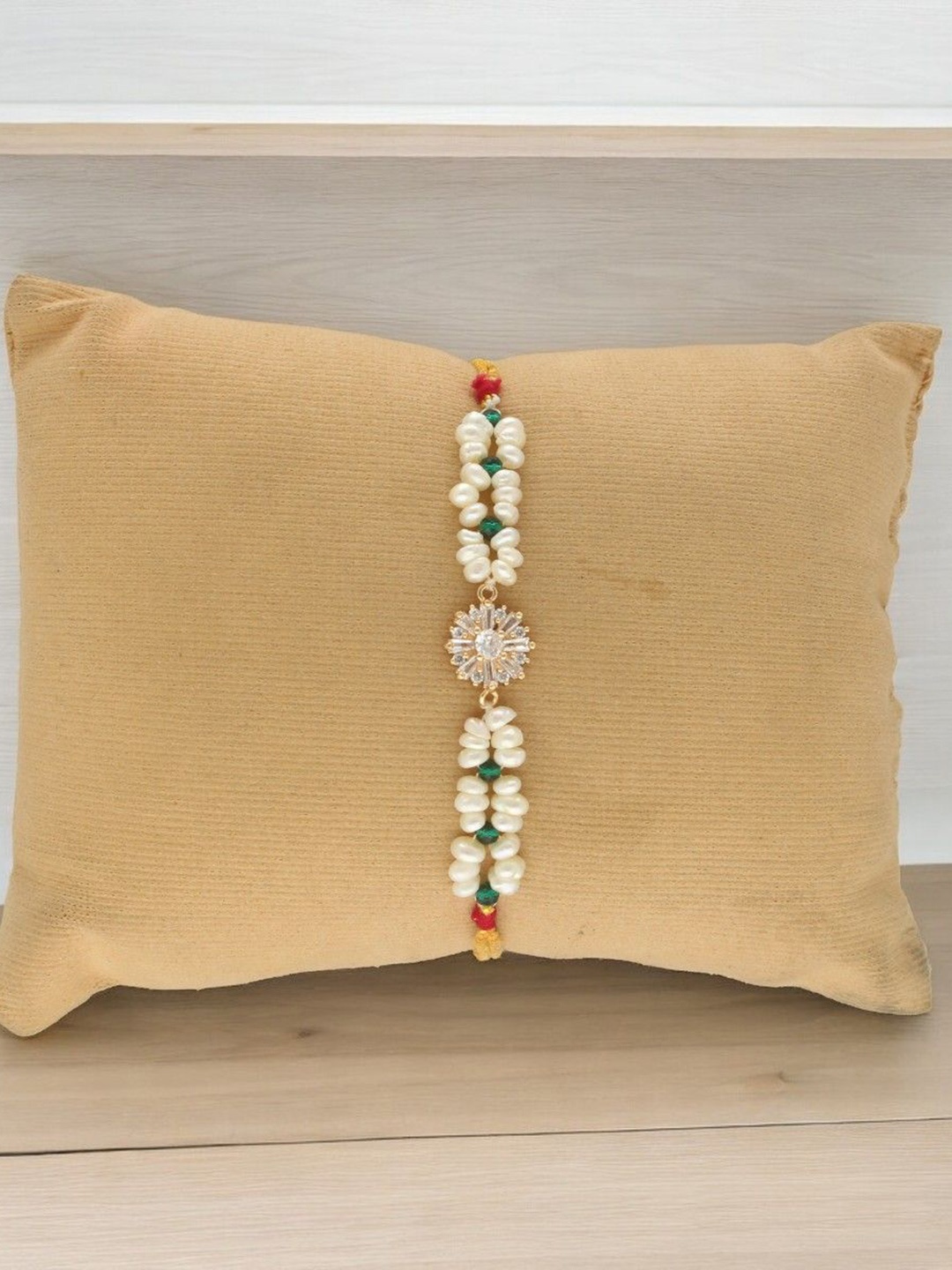 

Sri Jagdamba Pearls Dealer Elegance Fresh Water Pearls Bracelet Thread Rakhi, White