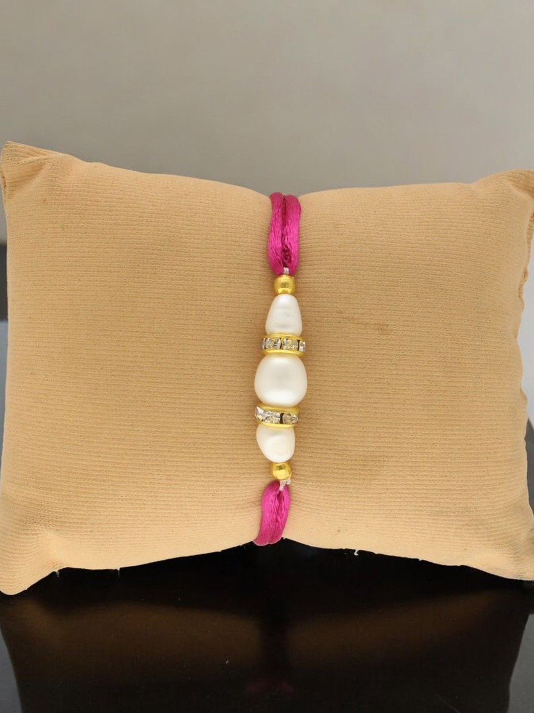 

Sri Jagdamba Pearls Dealer Fresh Water Pearls Thread Rakhi, White