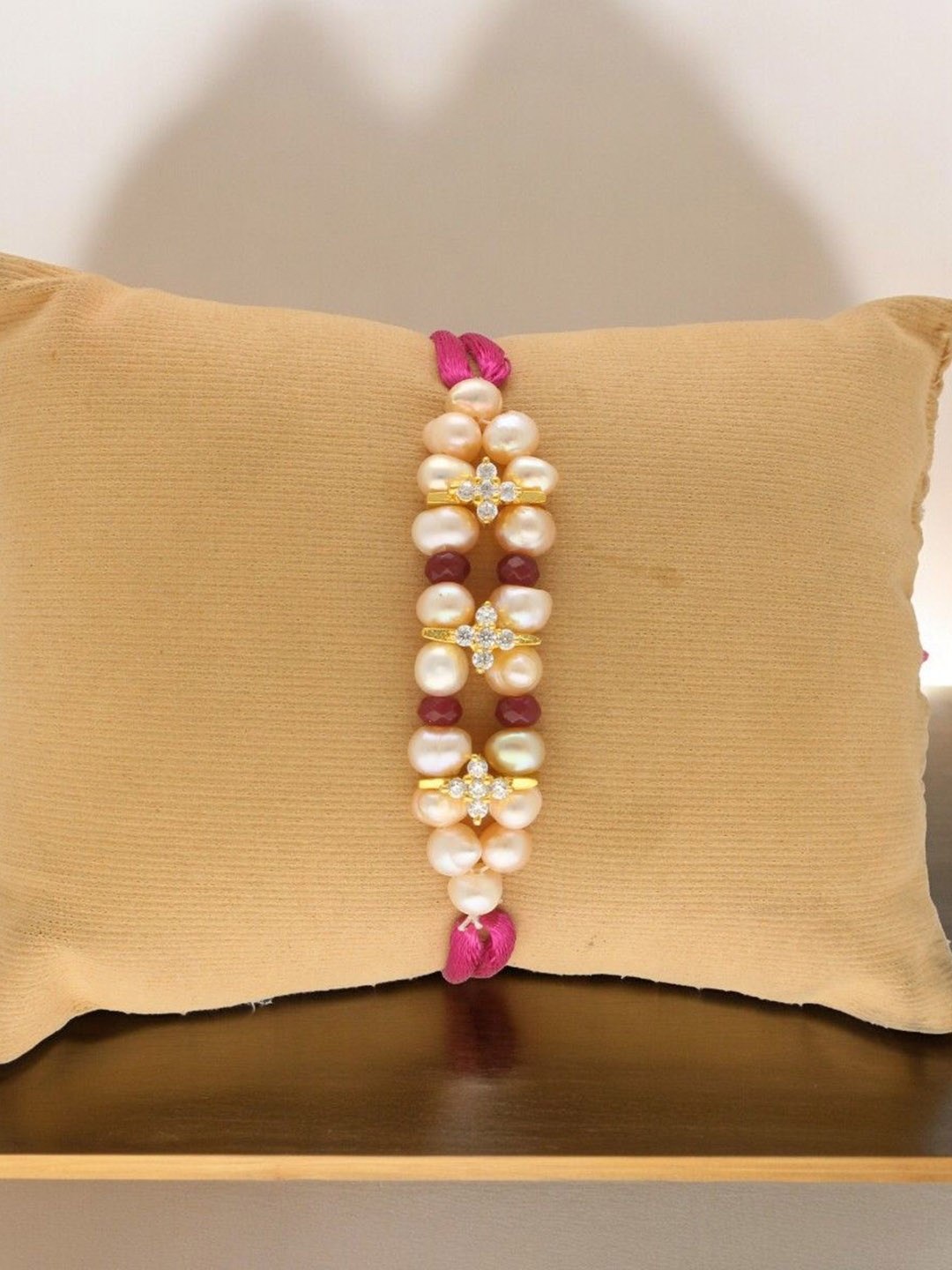 

Sri Jagdamba Pearls Dealer Fresh Water Pearls Thread Rakhi, Pink