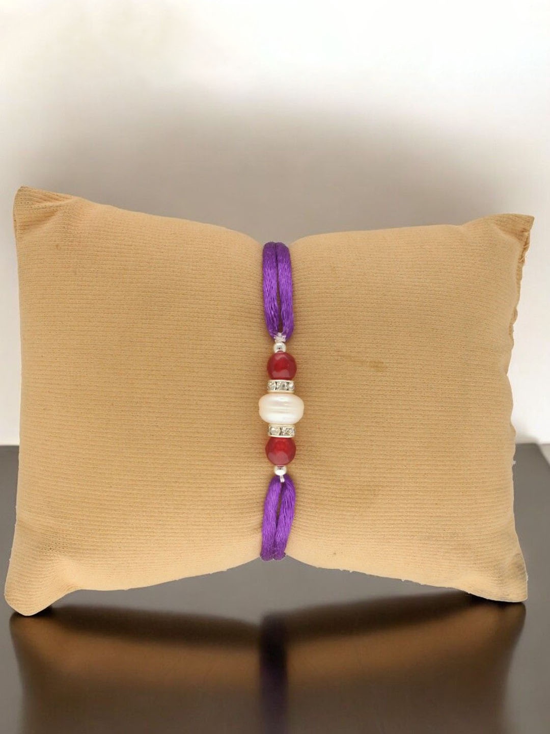 

Sri Jagdamba Pearls Dealer Eternity Fresh Water Pearls Thread Rakhi, Silver