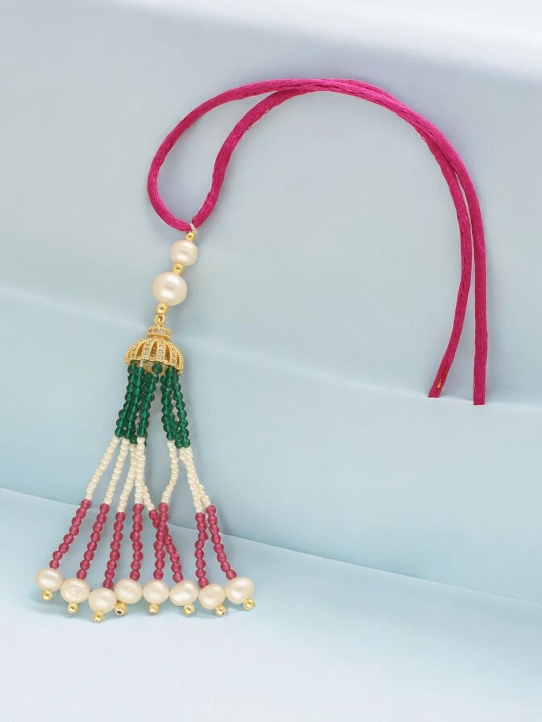 

Sri Jagdamba Pearls Dealer Shinning Designer Fresh Water Pearls Lumba Rakhi, Gold