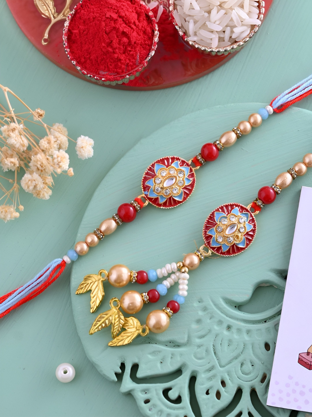 

Ascension Set Of 3 Rakhi With Fridge Magnet & Roli Chwal, Red