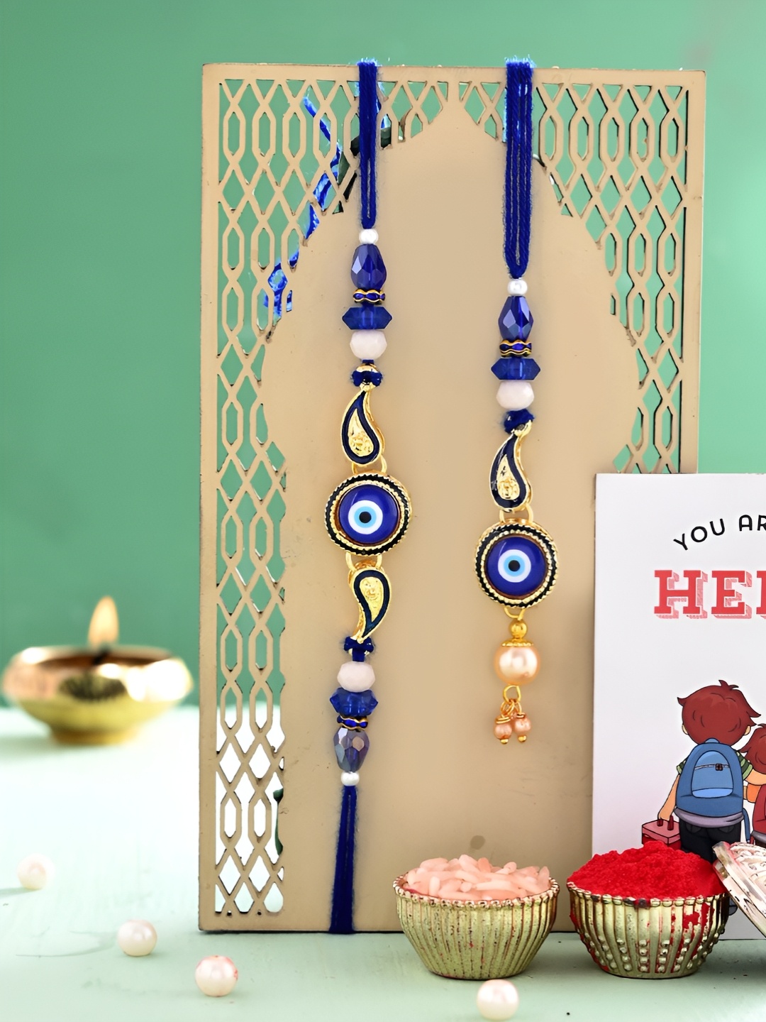 

Ascension Set Of 2 Bhaiya Bhabhi Rakhi With You Are My Hero Fridge Magnet, Blue