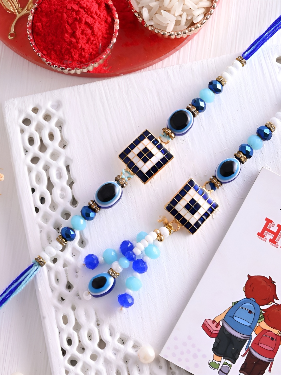 

Ascension Set Of 3 Rakhi With Fridge Magnet & Roli Chwal, Blue