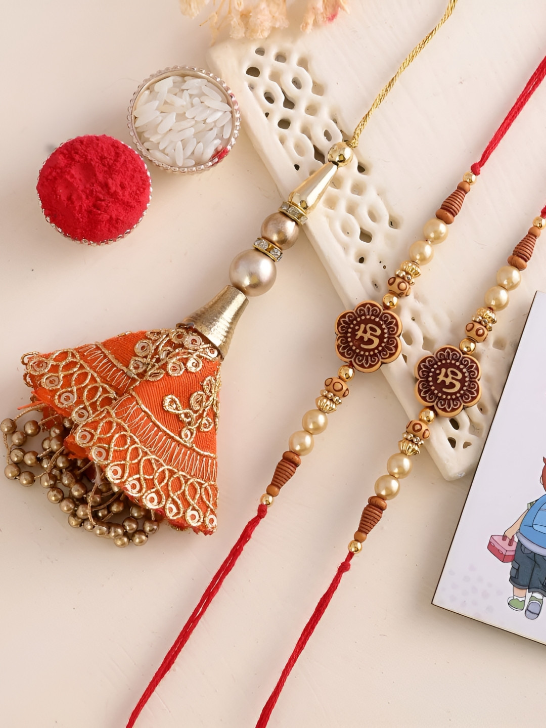

Ascension Set Of 4 Rakhi With Fridge Magnet & Roli Chwal, White