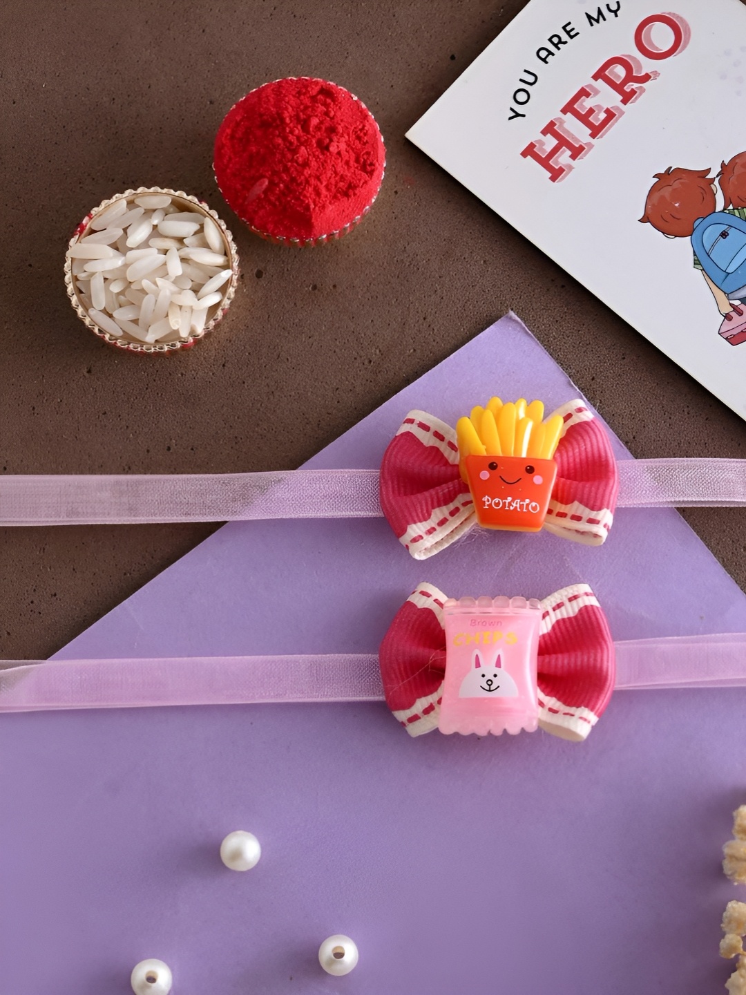 

Ascension Set Of 3 Rakhi With Fridge Magnet & Roli Chwal, Pink