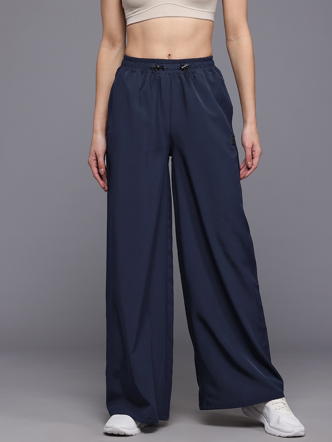 

HRX by Hrithik Roshan Women Mid-Rise Regular Fit Lifestyle Flared Track Pants, Navy blue