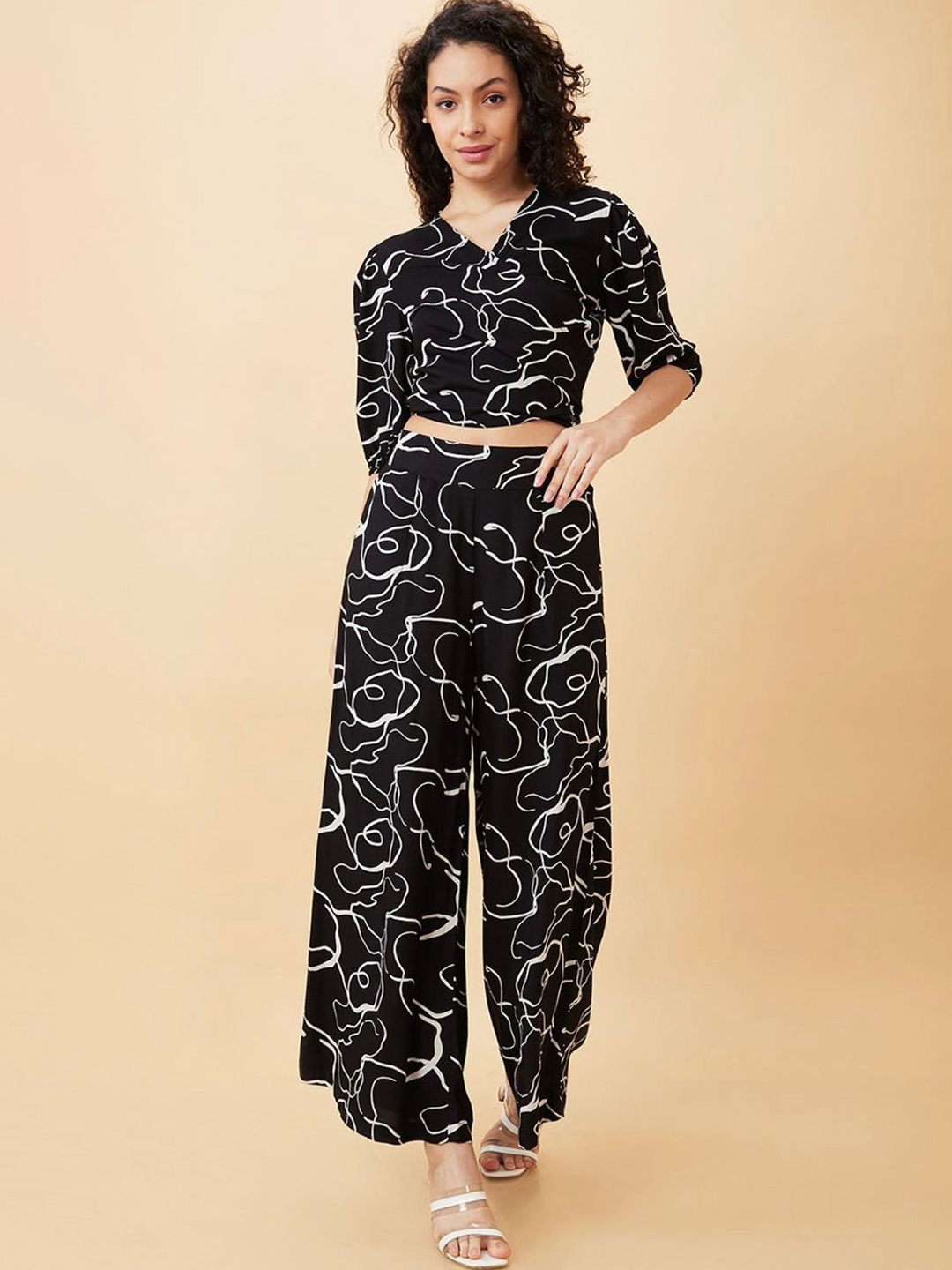 

Molly & Michel Abstract Printed Puff Sleeves Tie-Ups Wrap Crop Top & Palazzos, Black