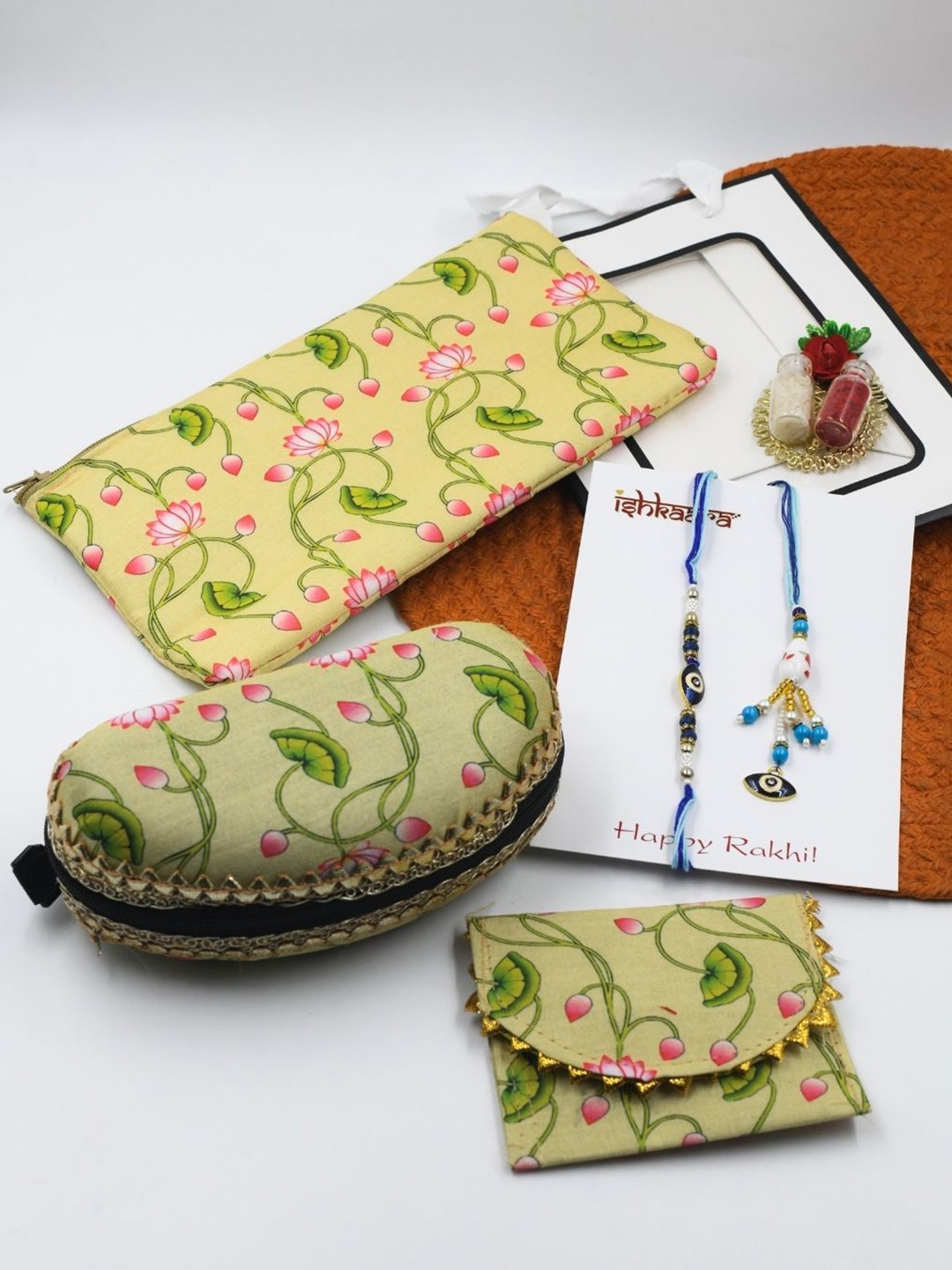 

ISHKAARA Set Of 5 Bhaiya Bhabhi Evil Eye Rakhi With Floral Printed Pouches, Blue