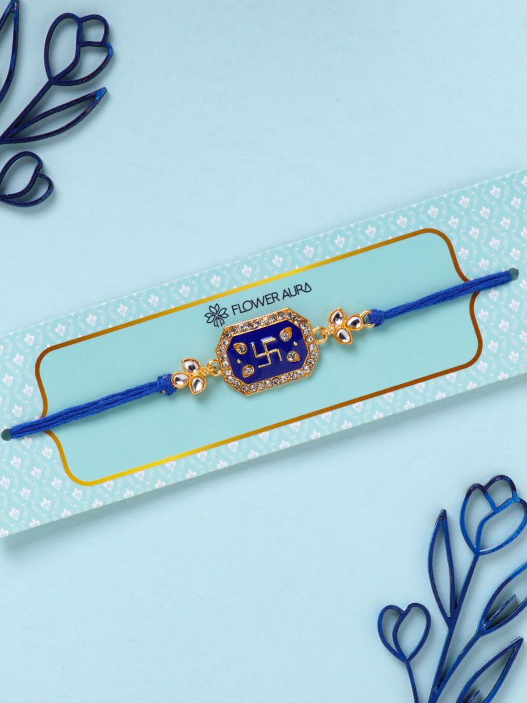 

Floweraura Swastik Stone Studded Thread Rakhi With Roli Chawal, Blue