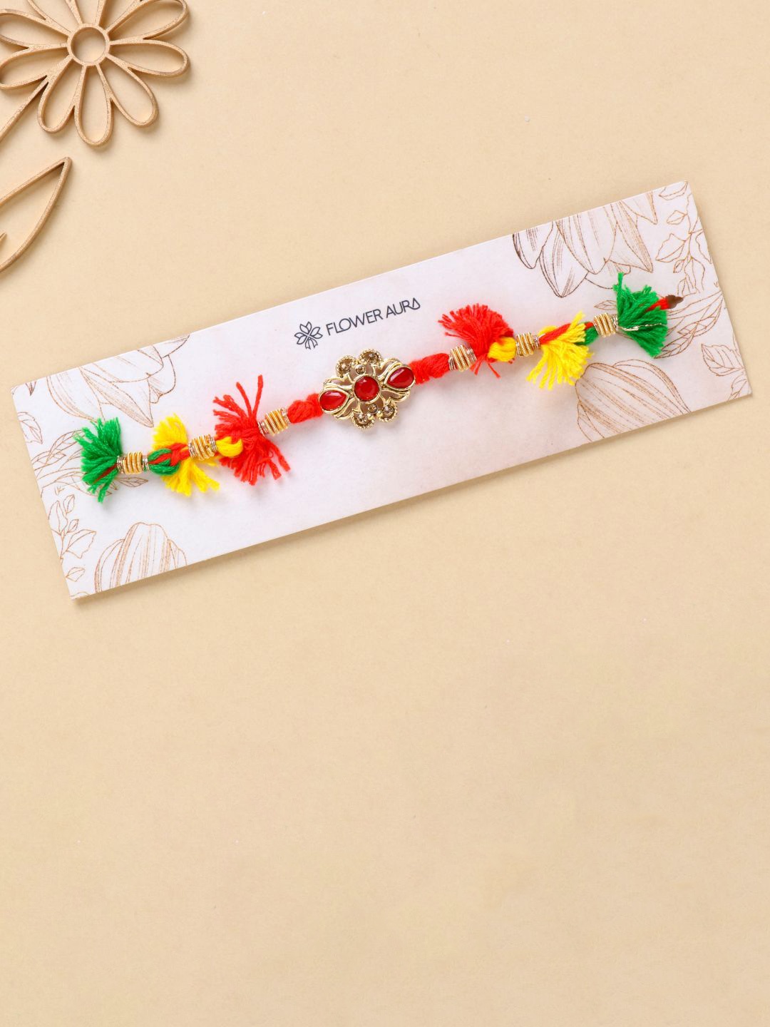 

Floweraura Stone Studded Thread Rakhi With Roli Chawal, Gold