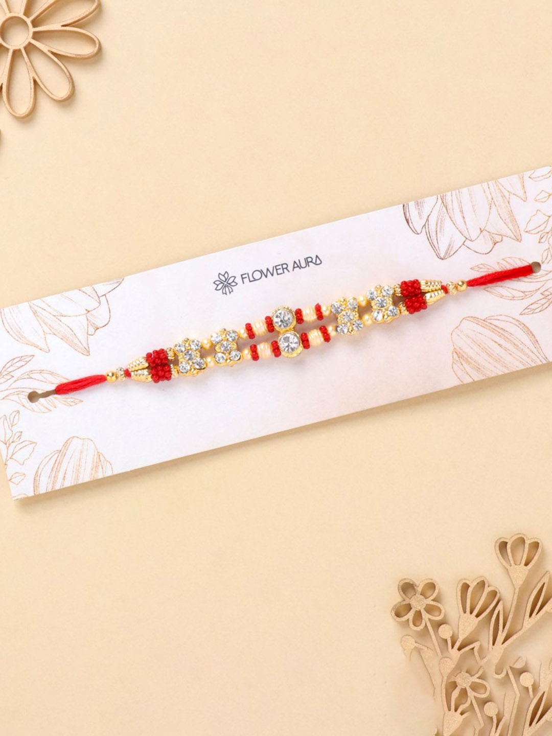 

Floweraura Stone Studded & Beaded Thread Rakhi With Roli Chawal, Gold