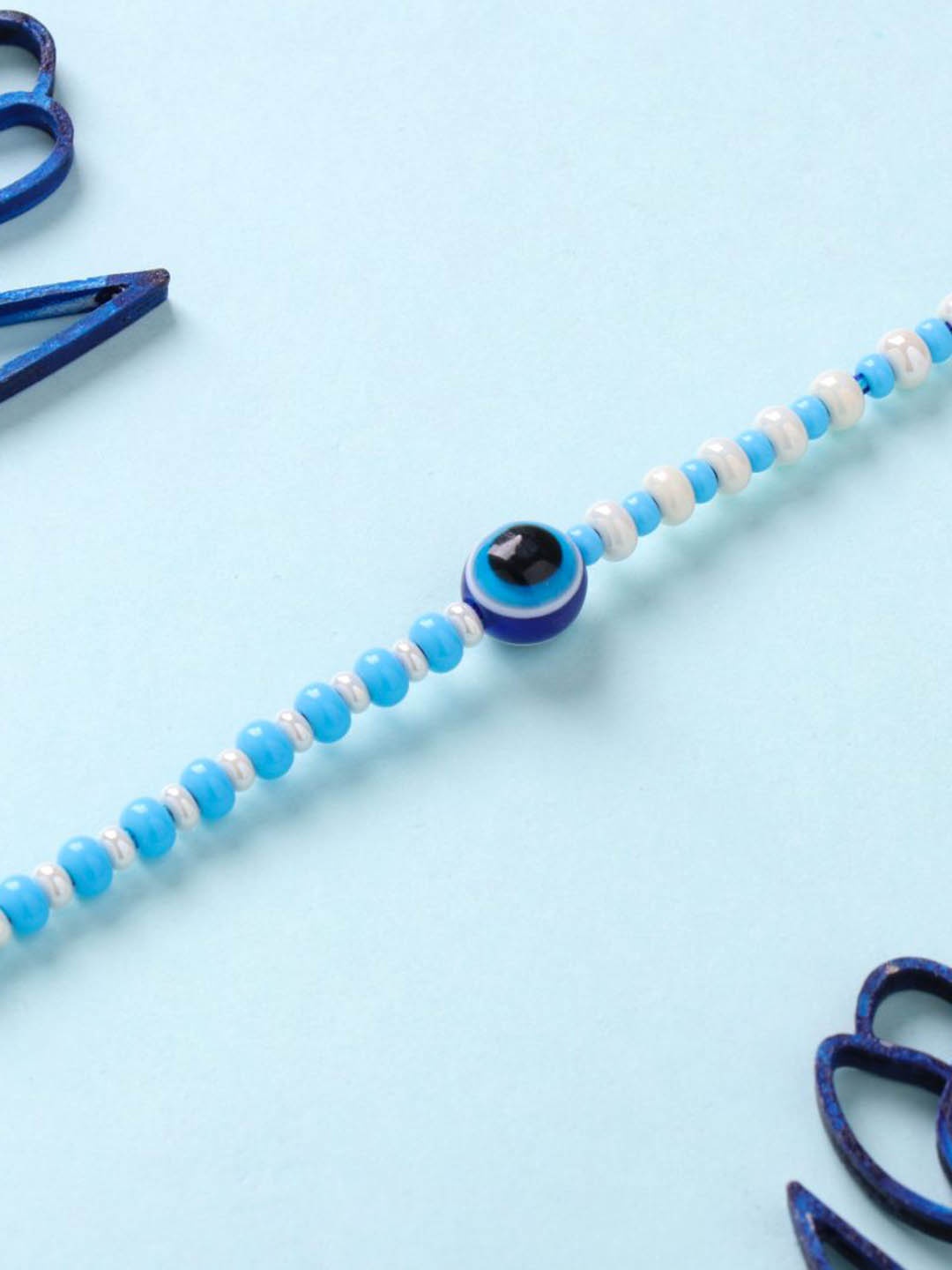 

Floweraura Beaded Evil Eye Rakhi With Roli Chawal & Greeting Card, Blue
