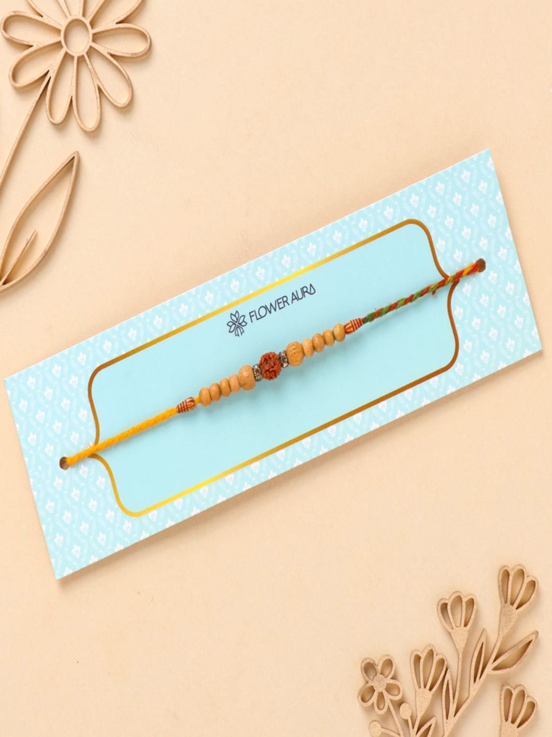 

Floweraura Rudraksha Mauli Stone Studded & Beaded Thread Rakhi With Roli Chawal, Orange