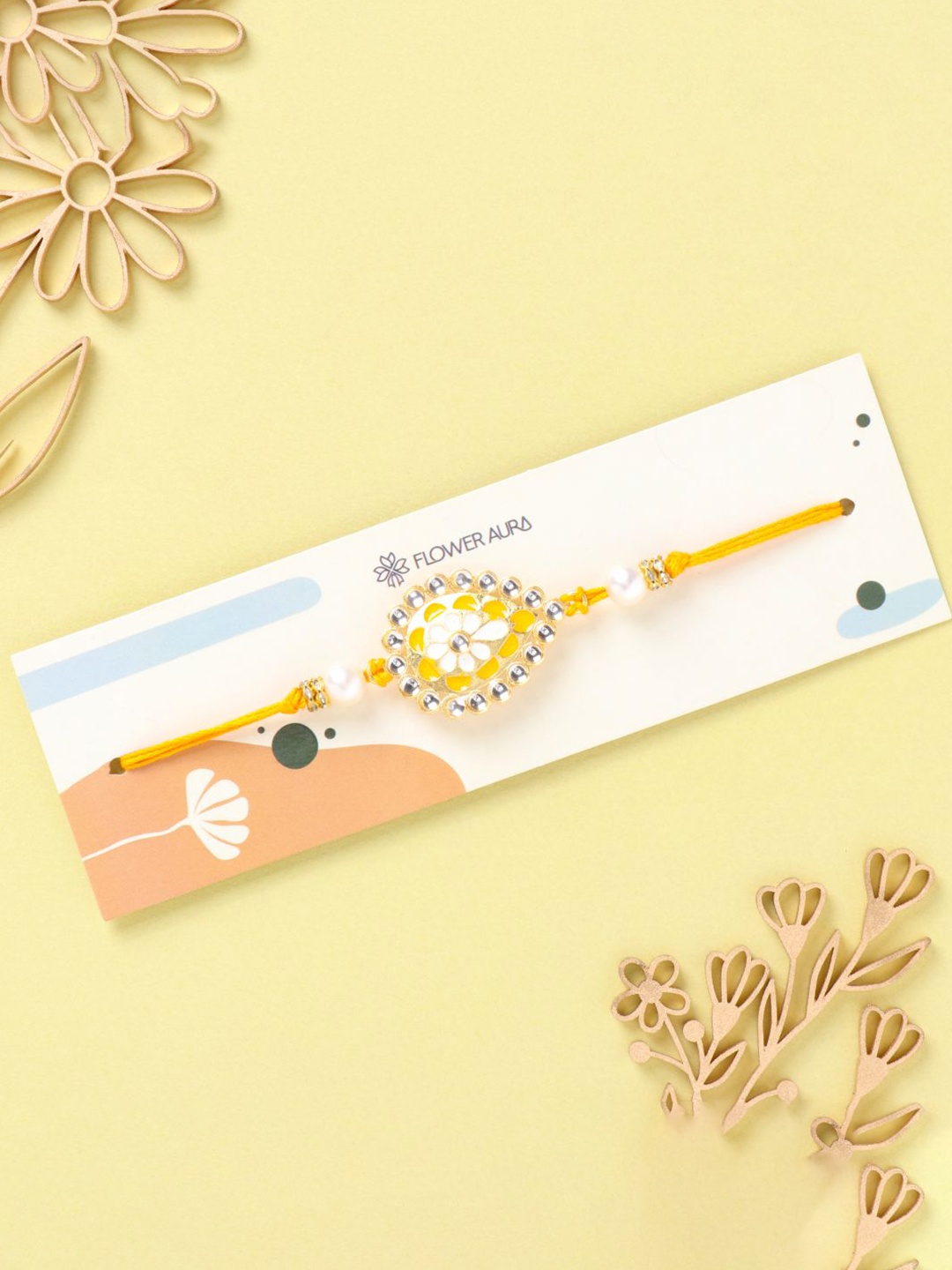 

Floweraura Beaded Kundan Thread Rakhi with Roli Chawal, Yellow
