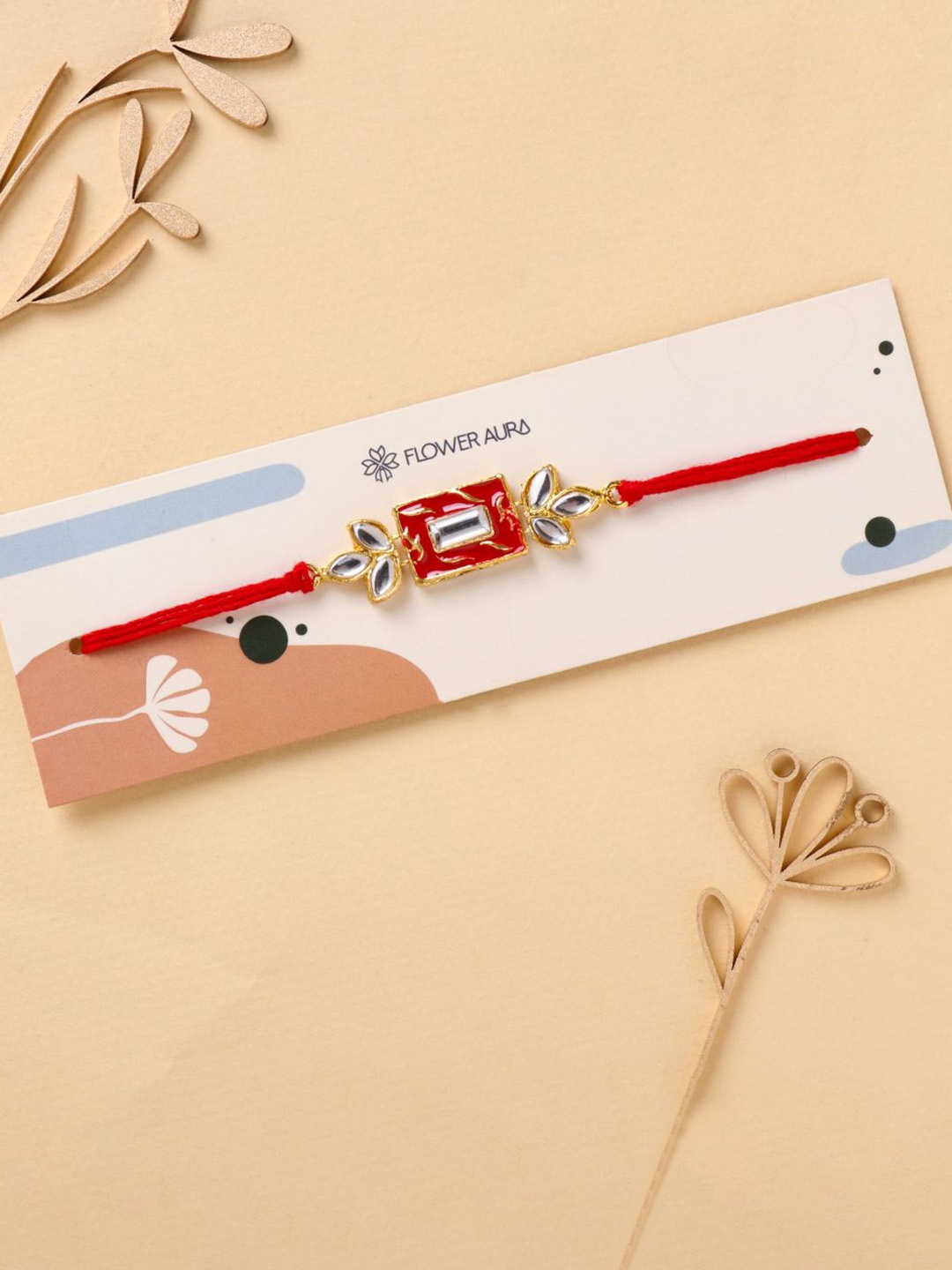 

Floweraura Stone Studded Thread Rakhi With Roli Chawal, Red
