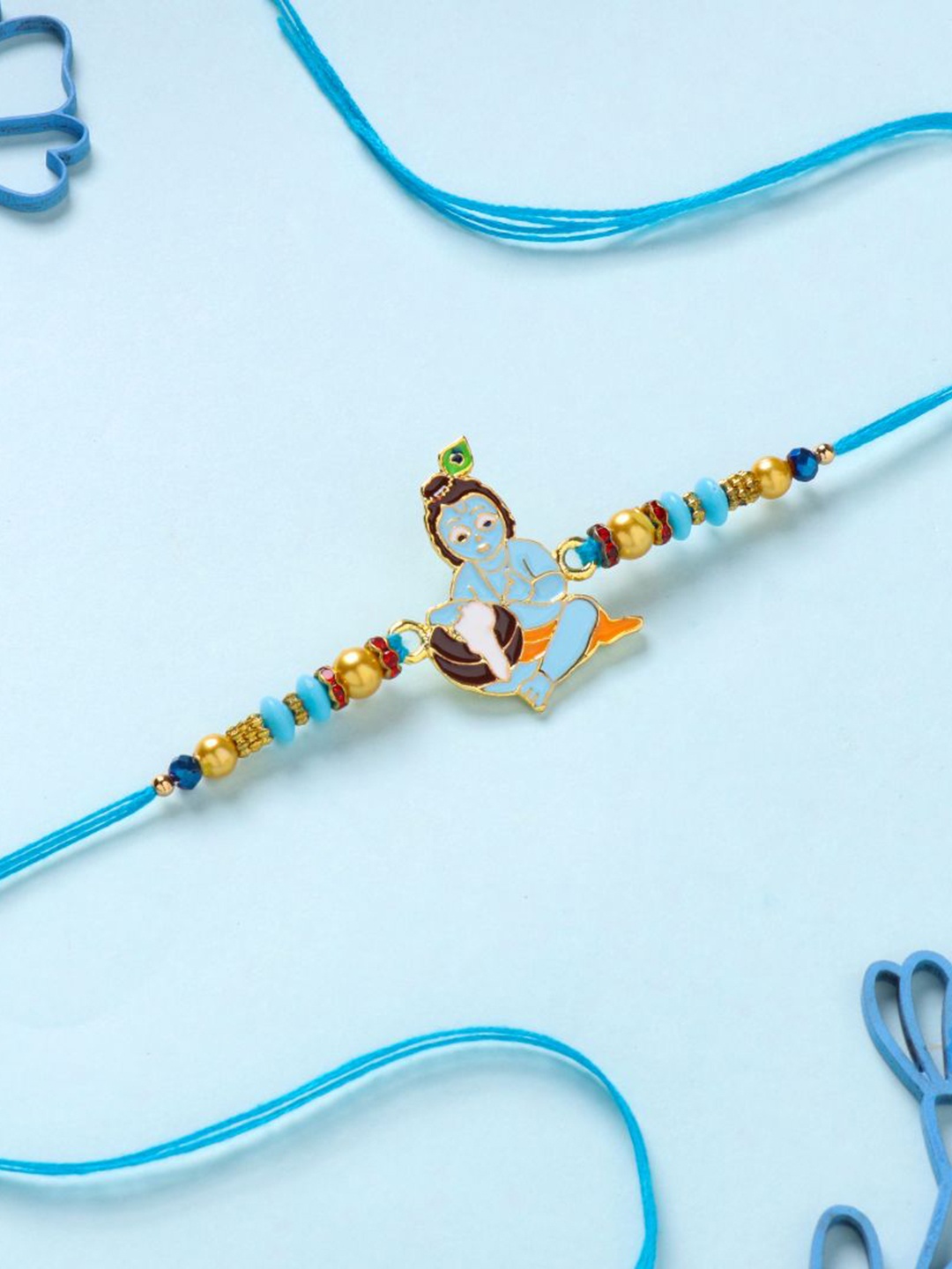 

Floweraura Krishna Charm Beaded Thread Rakhi With Roli Chawal, Gold