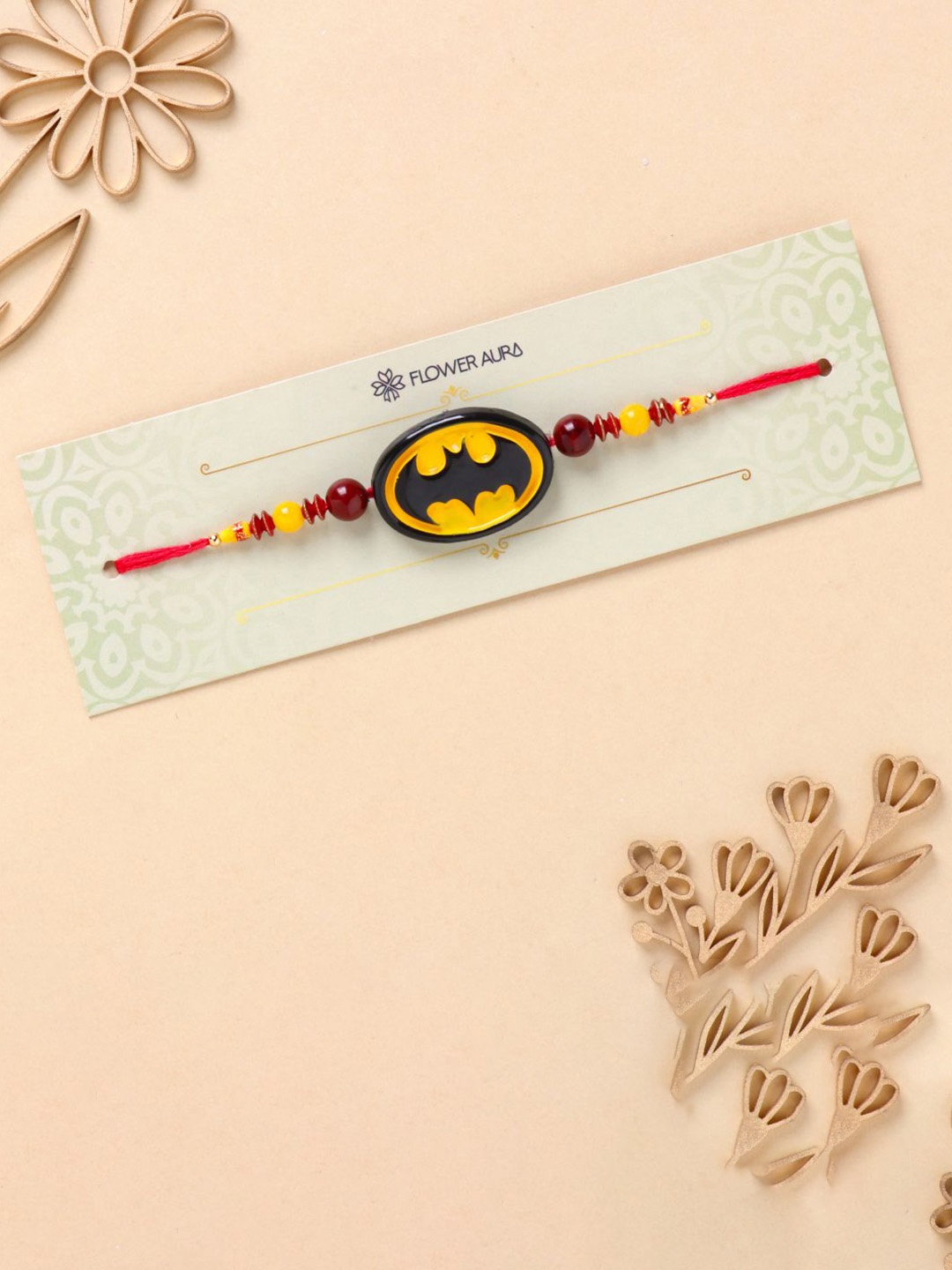 

Floweraura Batman Theme Charm Thread Rakhi With Roli Chawal, Yellow