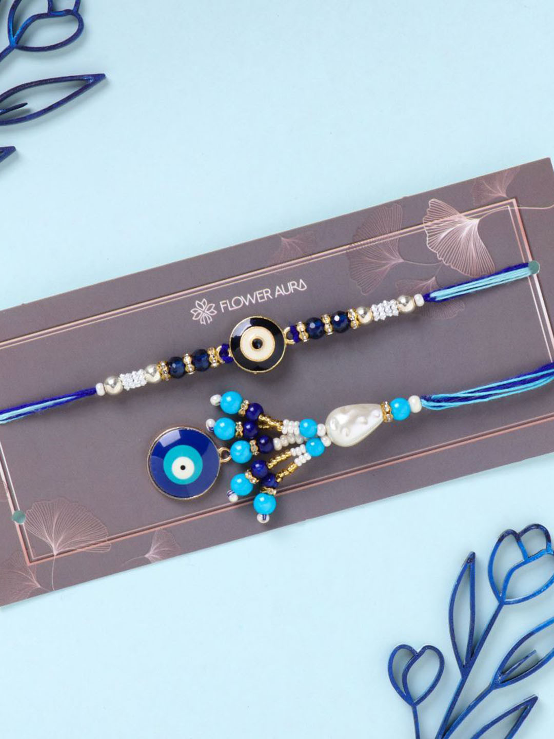 

Floweraura Evil Eye Bhaiya Bhabhi Rakhi With Roli & Chawal, Blue