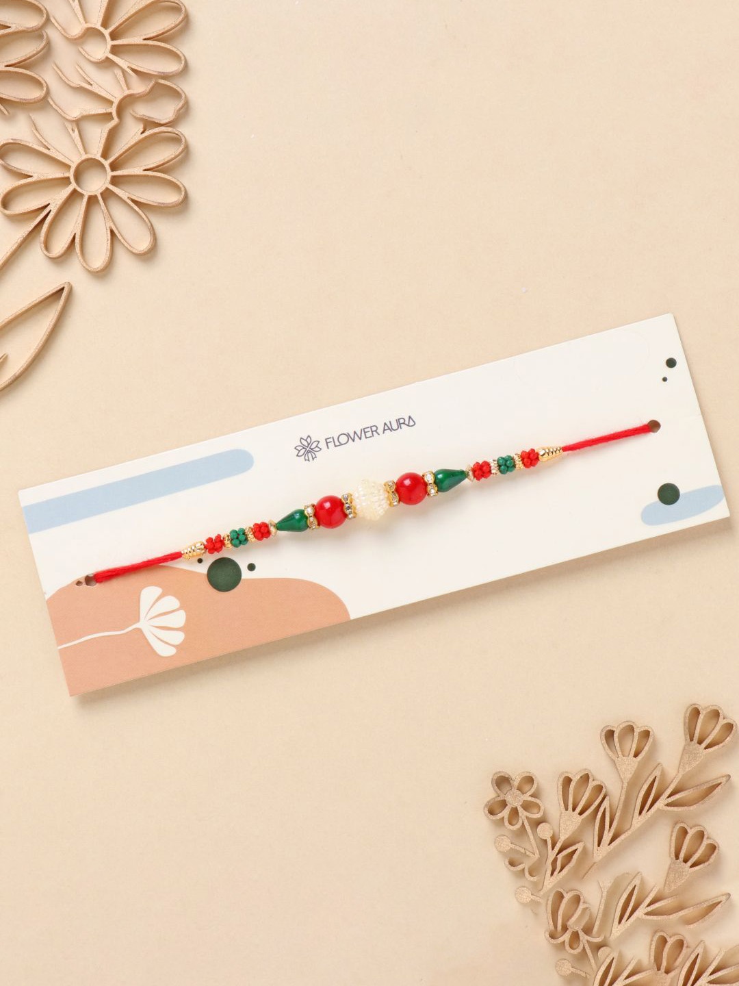 

Floweraura Stone Studded & Beaded Thread Rakhi With Roli Chawal, Red