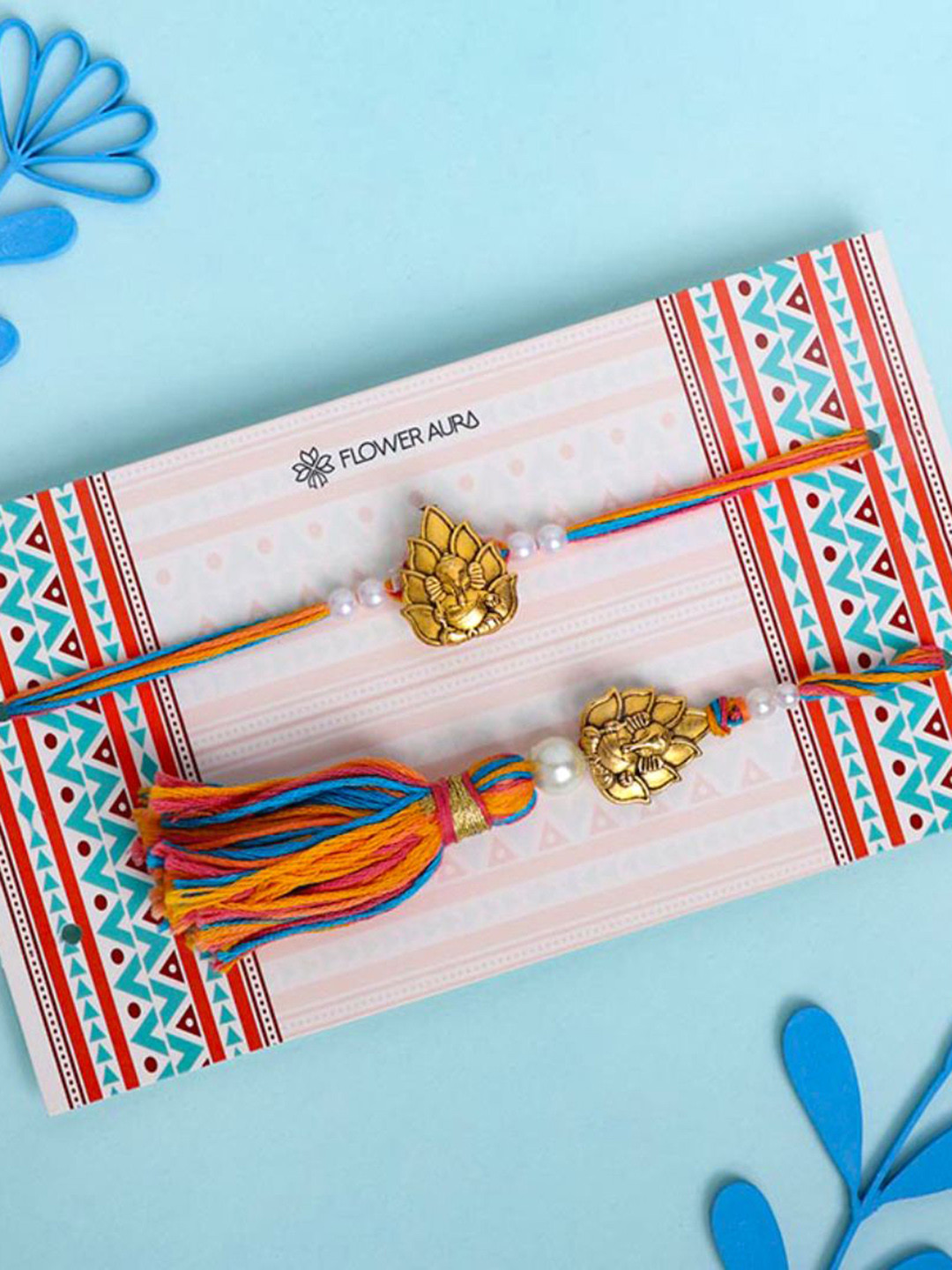 

Floweraura Lors Ganesha Bhaiya Bhabhi Thread Rakhis with Roli Chawal, Gold