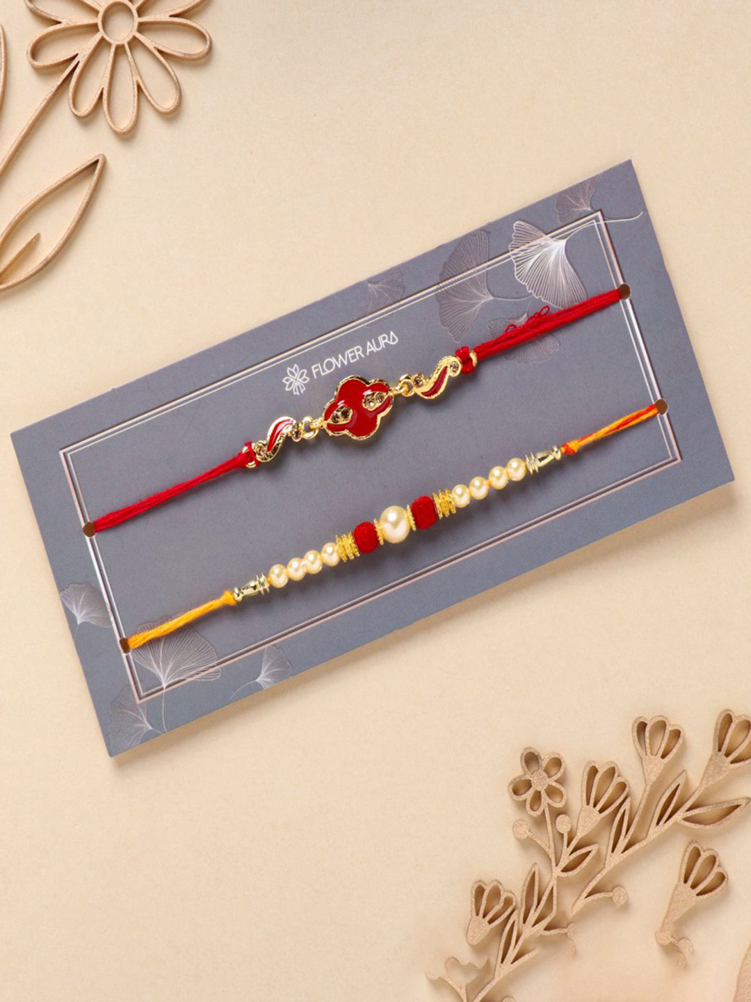 

Floweraura Set Of 2 Beaded Thread Rakhis With Roli Chawal, Red