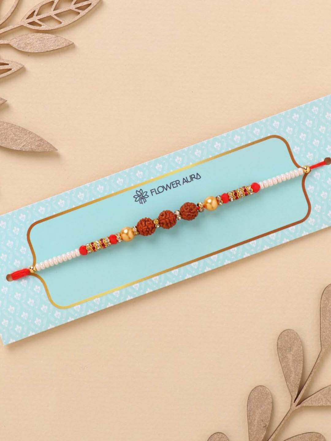 

Floweraura Rudraksha Thread Rakhi with Roli Chawal, Red