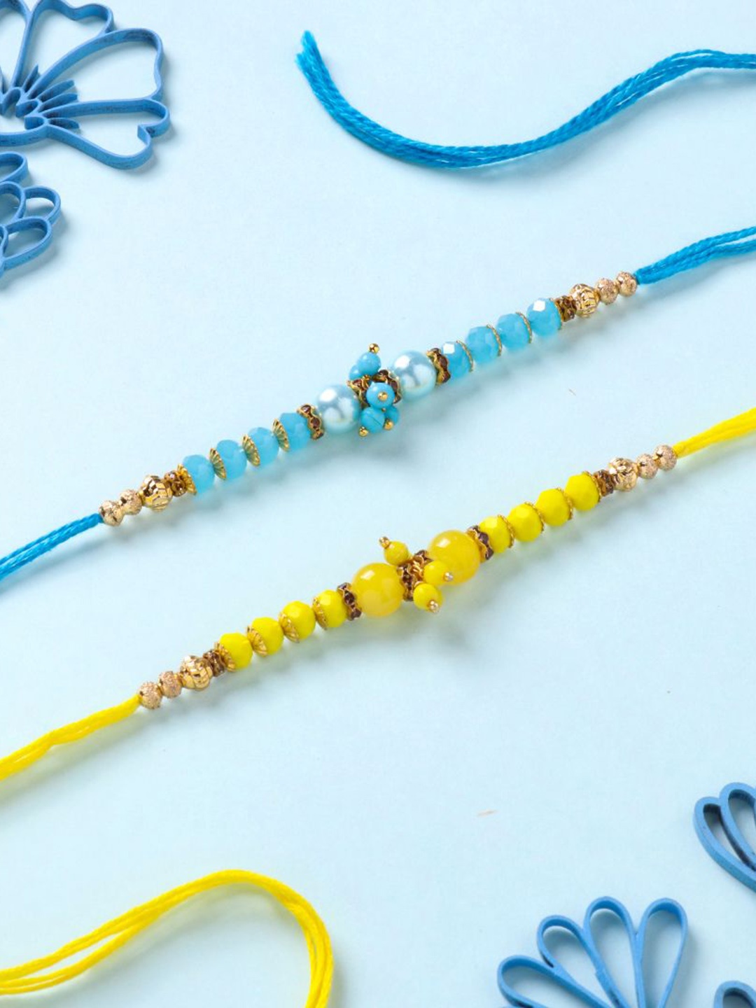 

Floweraura Set Of 2 Beaded Thread Rakhis With Roli Chawal, Yellow