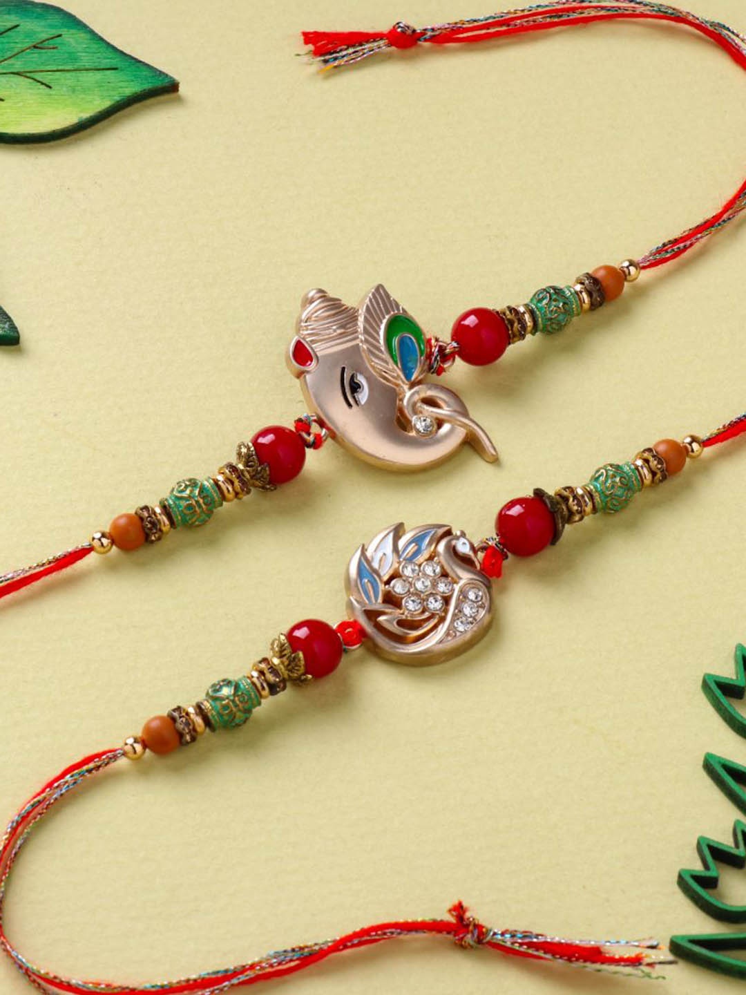 

Floweraura Set of 2 Lord Ganesha Thread Rakhis with Roli Chawal, Red