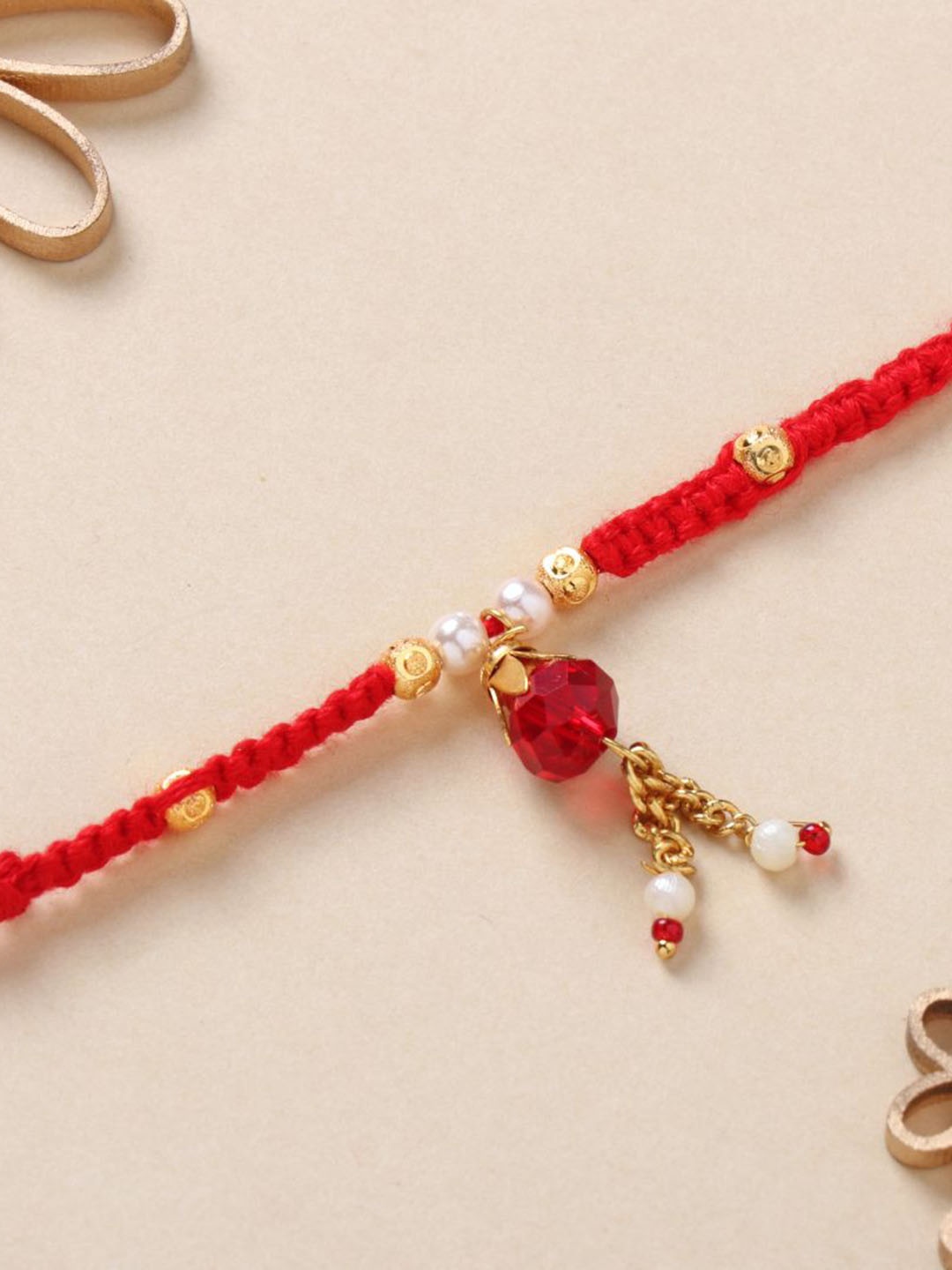 

Floweraura Stone Studded & Pearl Beaded Thread Rakhi With Roli Chawal, Red