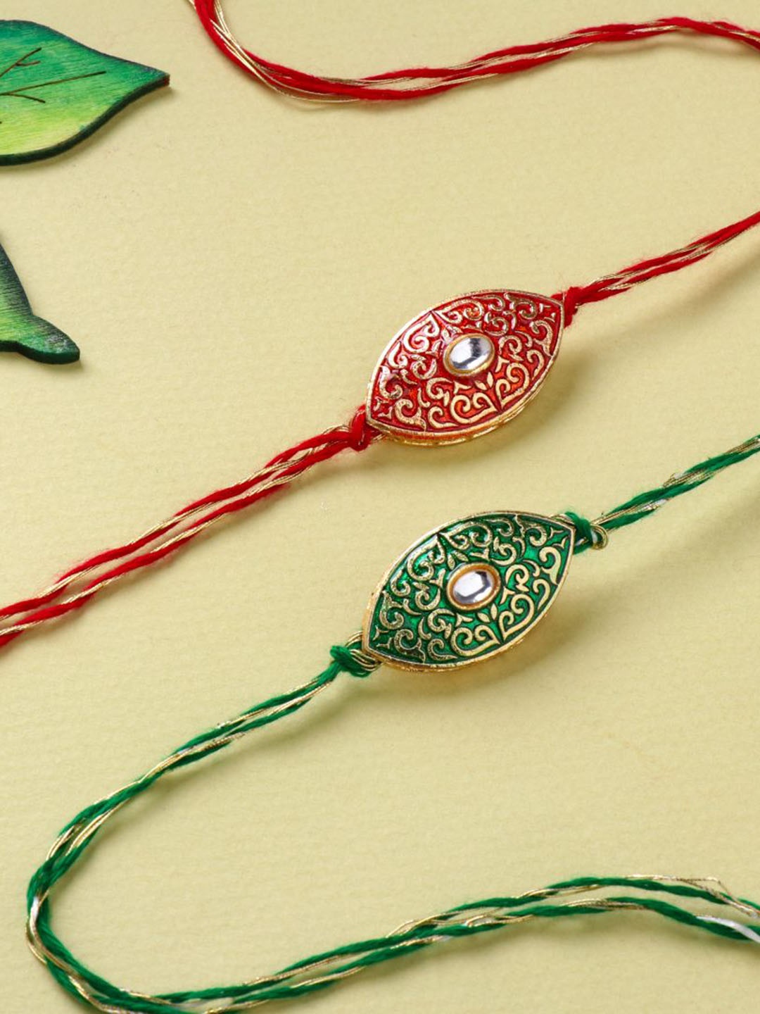 

Floweraura Set Of 2 Stone Studded Thread Rakhis With Roli Chawal, Green