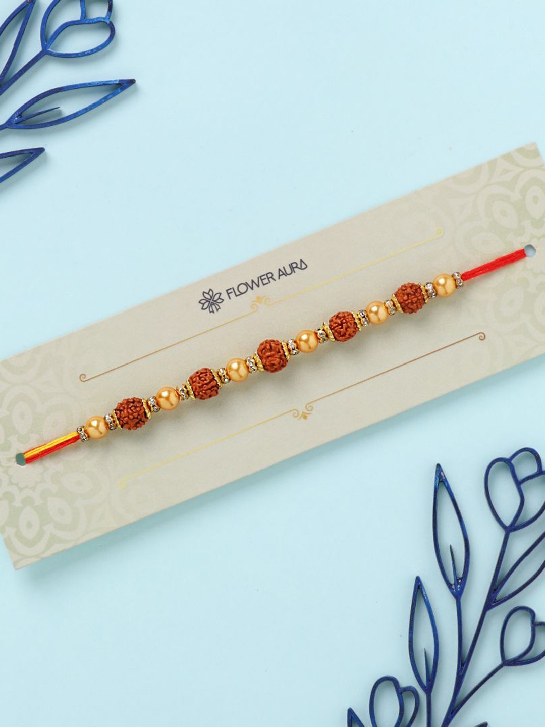 

Floweraura Rudraksh Thread Rakhi With Roli & Chawal, Red