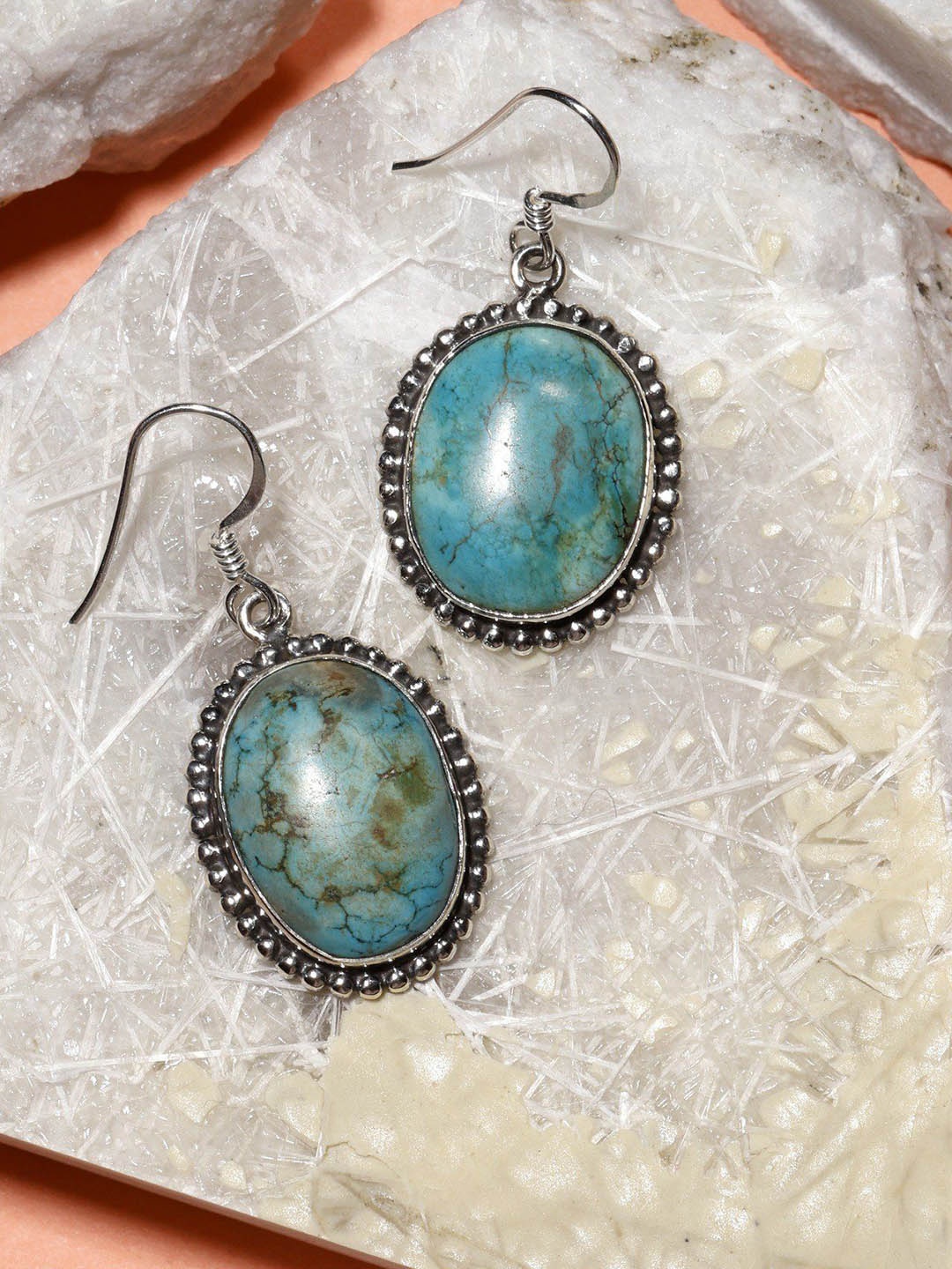 

Exotic India Tibetan Turquoise Oval Sterling Silver Hook Earrings