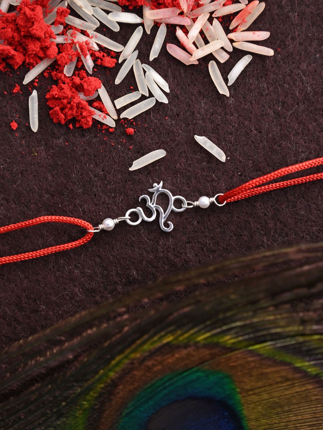 

Clara 92.5 Sterling Silver Om Religious Thread Rakhi