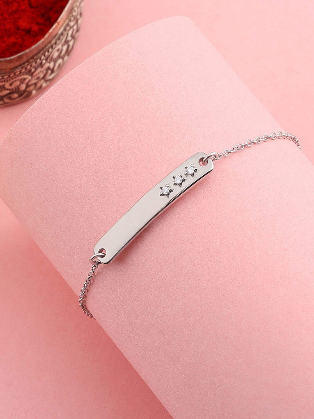 

Ornate Jewels 925 Silver American Diamond Bracelet Rakhi With Roli Chawal