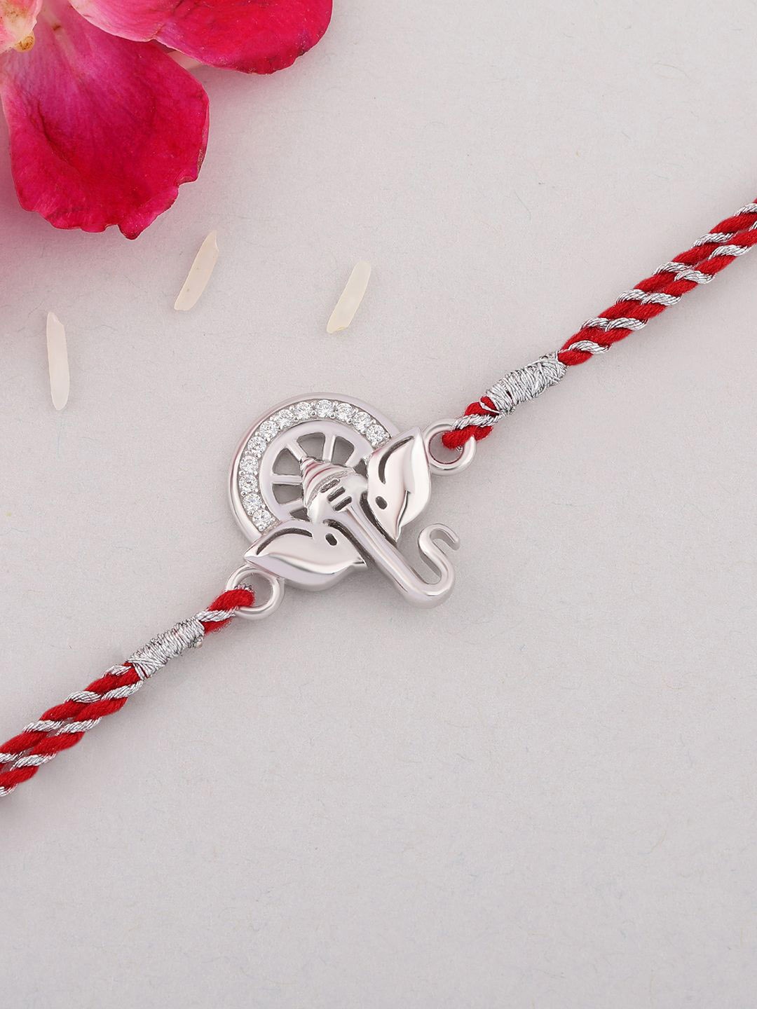 

Ornate Jewels 925 Silver American Diamond Lord Ganesha Rakhi With Roli Chawal