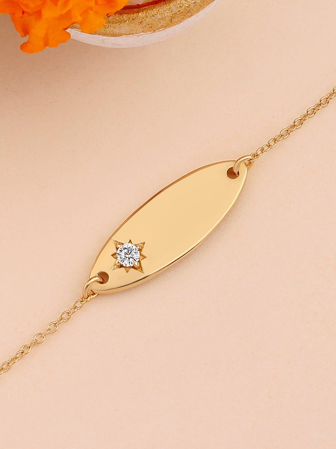 

Ornate Jewels 925 Silver 18K Gold Plated American Diamond Rakhi With Roli Chawal