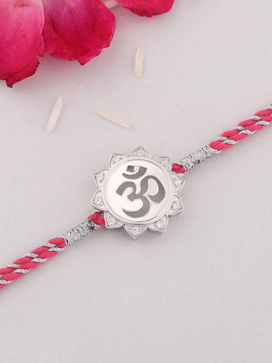 

Ornate Jewels 925 Silver American Diamond Om Charm Thread Rakhi With Roli Chawal