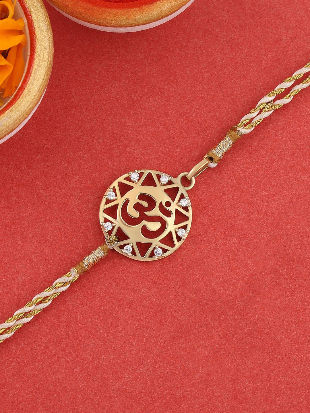 

Ornate Jewels 18K Gold Plated Om Charm Thread Rakhi With Roli Chawal