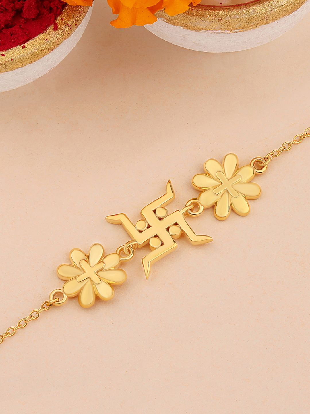 

Ornate Jewels 925 Silver 18K Gold Plated Floral Swastik Bracelet Rakhi With Roli Chawal