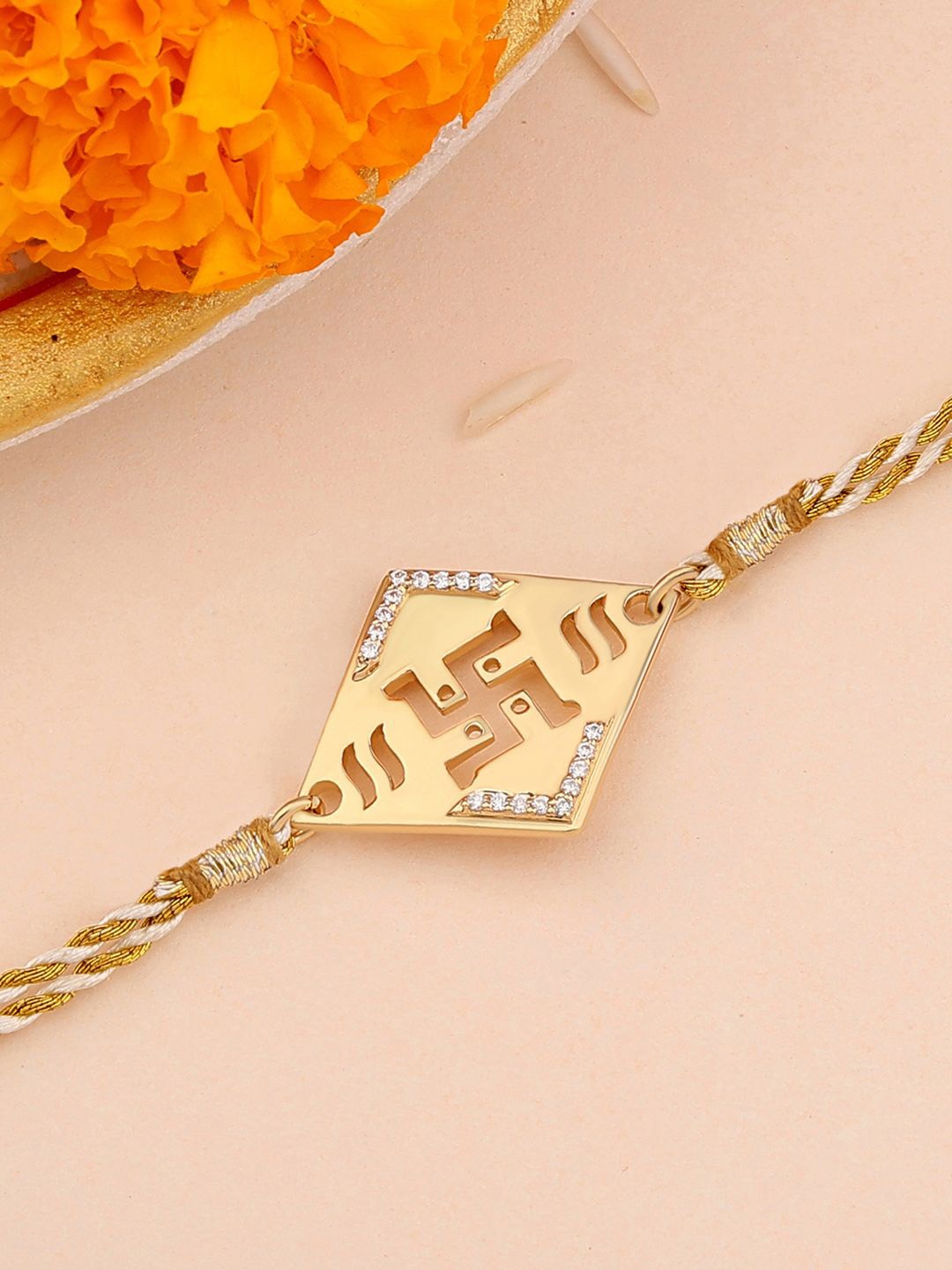 

Ornate Jewels 925 Silver 18K Gold Plated American Diamond Swastik Charm Thread Rakhi