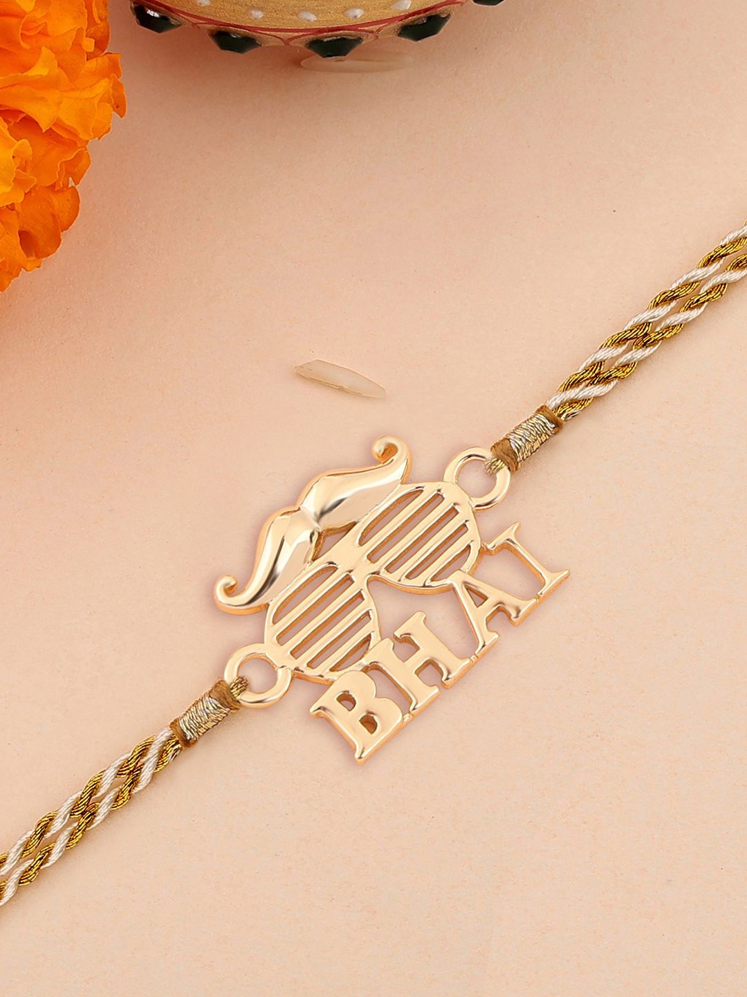 

Ornate Jewels Thread Rakhi, Gold