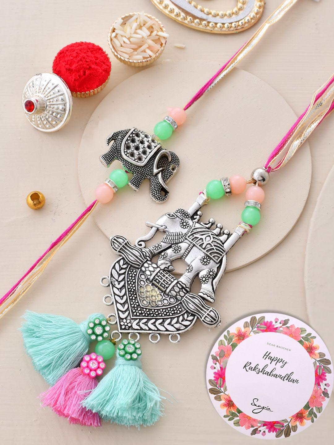 

Sangria Oxidised Elephant Resham Bhaiya Bhabhi Rakhi With Roli Chawal & Greeting Card, Silver